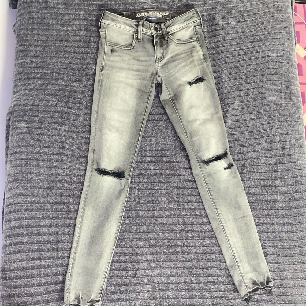 Low waisted dark gray ripped jeans